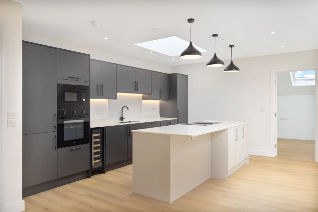 Completed apartment kitchen at Sale Road, Wythenshawe